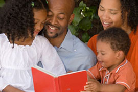 family reading a book